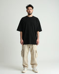 Close-up of premium 240GSM cotton fabric of Black Classic Oversized T-Shirt by Opium Valley