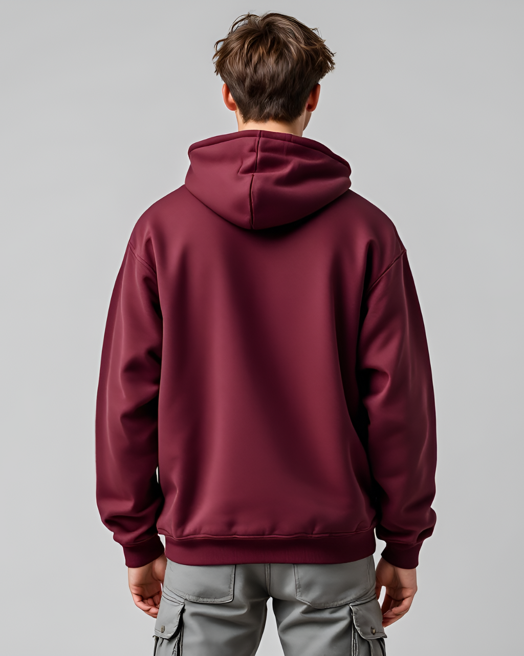 Comfortable maroon oversized hoodie with a stylish high neck and full sleeves, crafted from a premium cotton-polyester blend for casual layering.