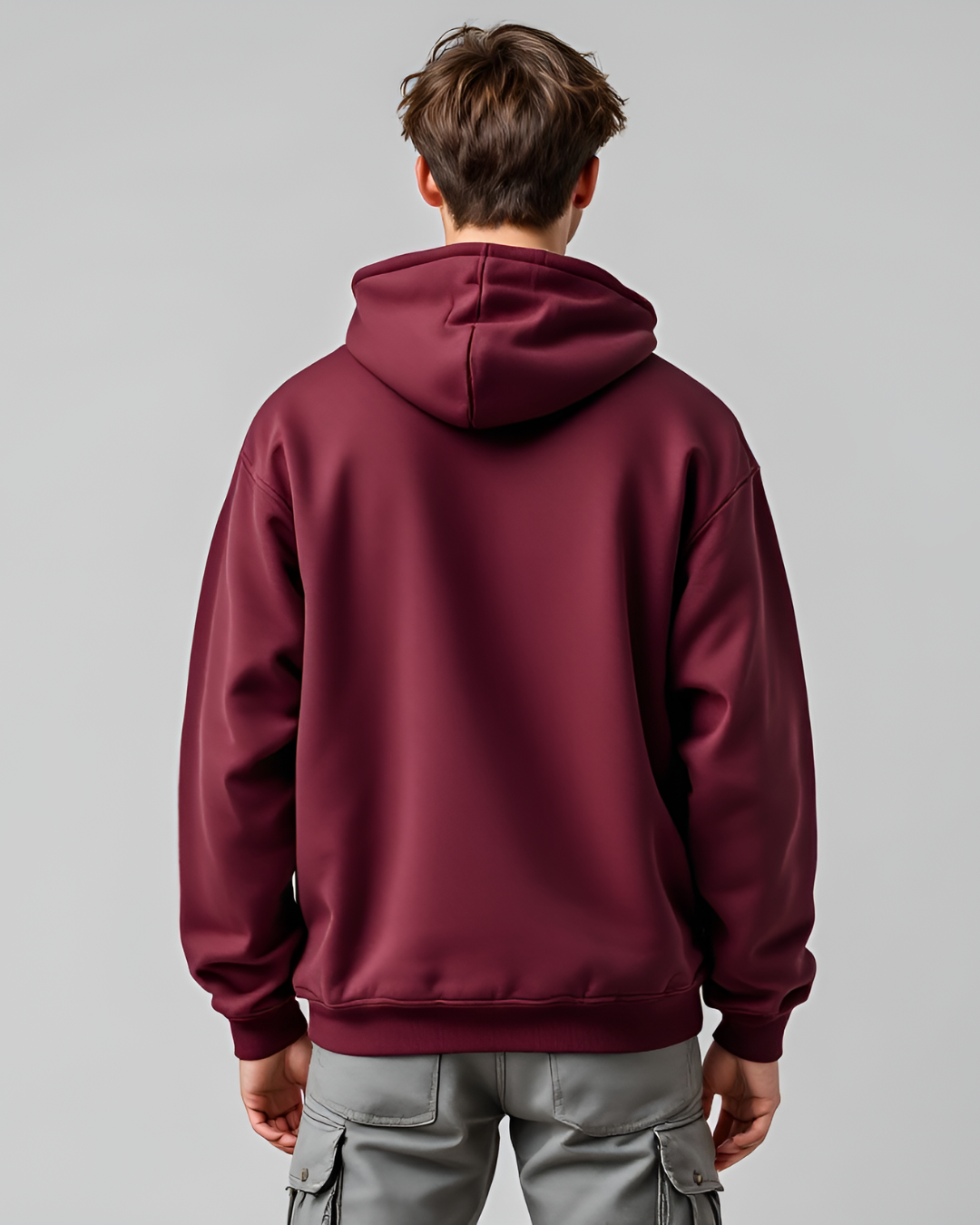 Comfortable maroon oversized hoodie with a stylish high neck and full sleeves, crafted from a premium cotton-polyester blend for casual layering.