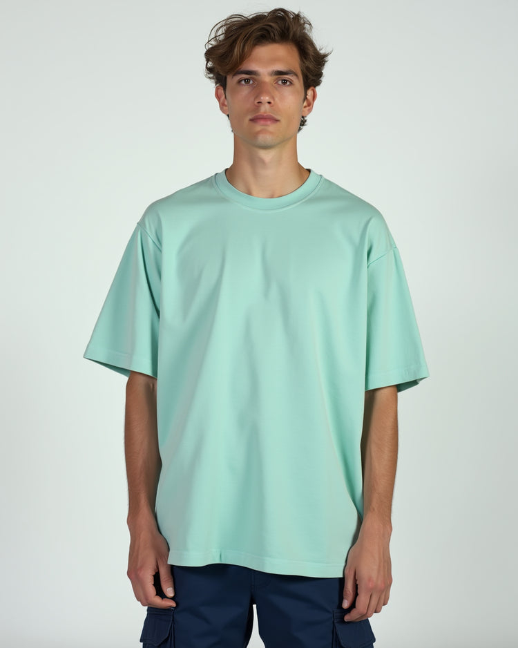Classic mint 240GSM oversize T-shirt, designed for a relaxed fit and all-day comfort. A perfect mix of style and durability.