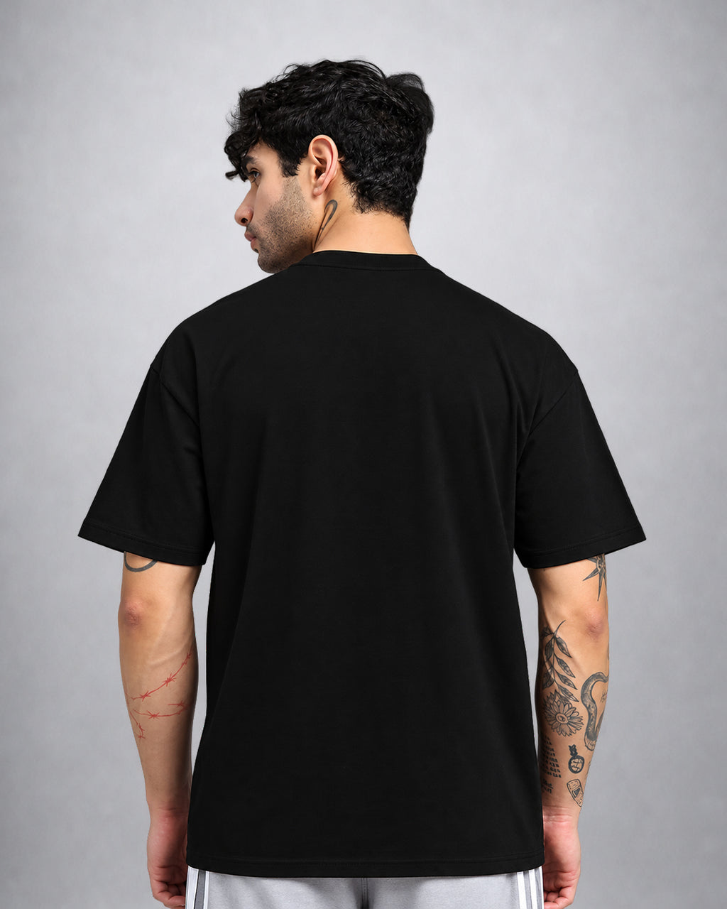 Plain black oversized t-shirt back view by Opium Valley, premium psychedelic streetwear India